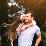 Young adult brunette man and woman in the park