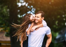 Young adult brunette man and woman in the park