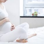 healthy nutrition and pregnancy. pregnant woman's belly and vegetable salad